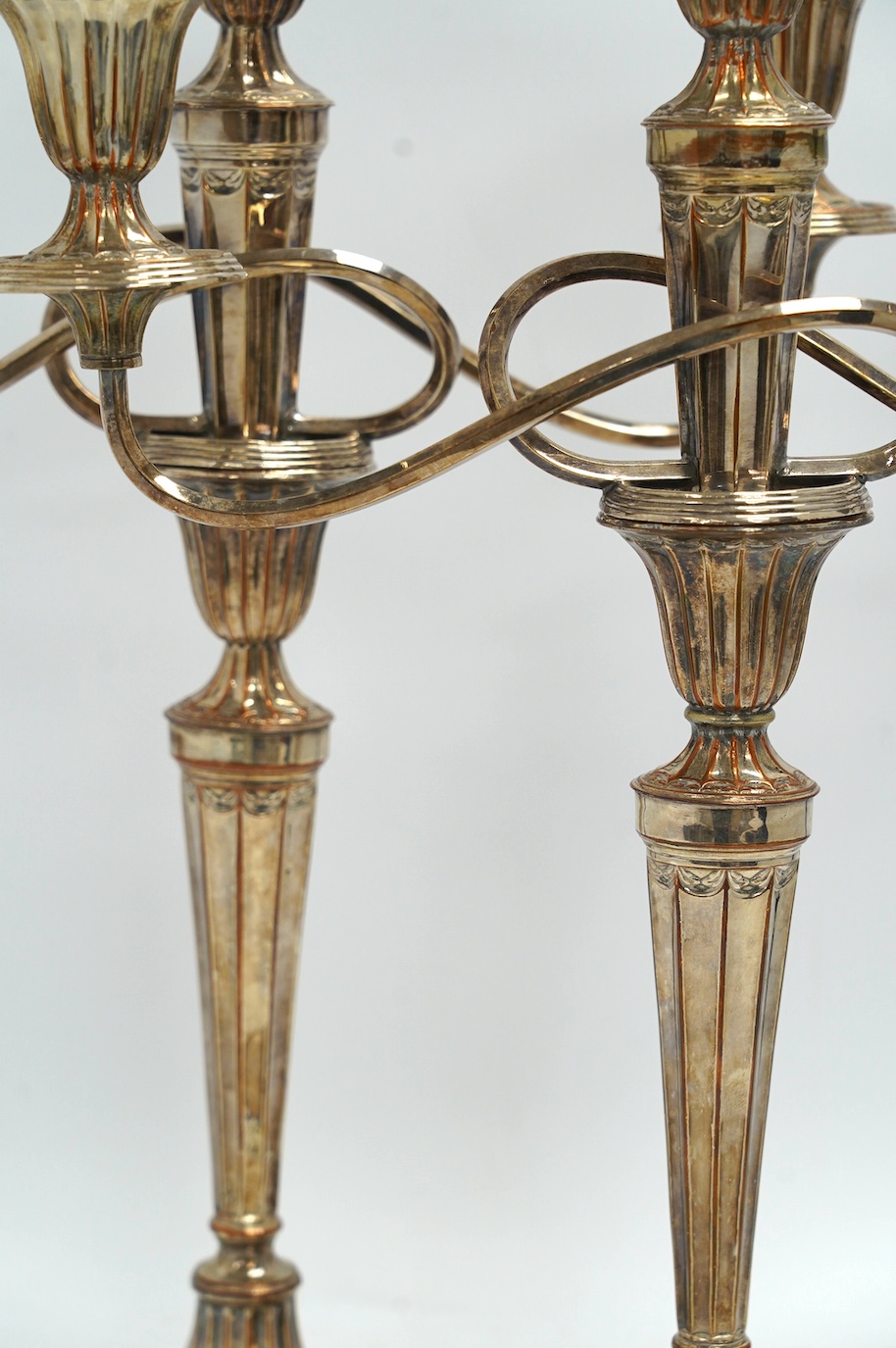 A pair of 19th century Old Sheffield plate three light, two branch candelabra, 44cm high. Condition - fair to good